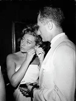 Franchetti: Afdera Franchetti putting on earrings to go out