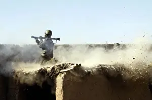 Helmand: An Afghan National Army soldier fires a ?
