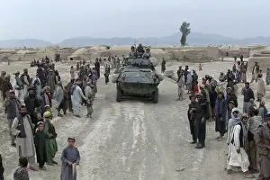 Afghans: Afghans mostly men and boys greet Marines ?