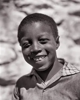 Disadvantaged: African-American Boy Looking at Camera Great Depression Era