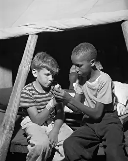 Lcgr1409: African American camper helps a White bubby with