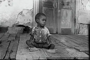 Norco: African American child on a dilapidated ?