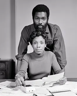 Solutions: African-American Couple looking at Camera Man