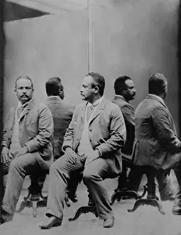Mulatto: African American man posed, in front of mirrors
