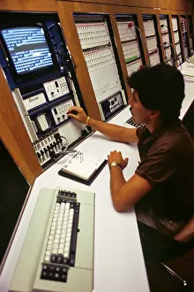 Latina: African American Man Technician Working at Computer