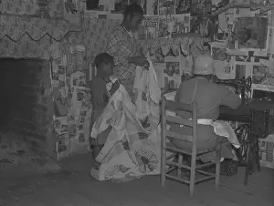 Gees: African American mother is assisted by her ?