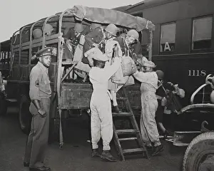 Womens Army Corps: African American nurses are helped out of an Army