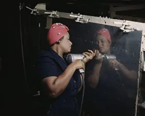 Riveter: An African American Rosy the Riveter, operating ?