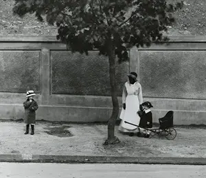 Womens Work: African American servant taking care of two young