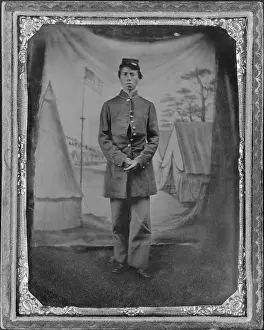 Photogra: African American soldier posed in front ?