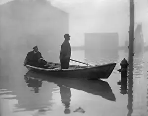 Under Water: An African American steers a boat through Georgetown