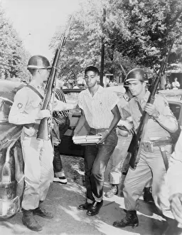 Enforcing: An African American student is escorted ?