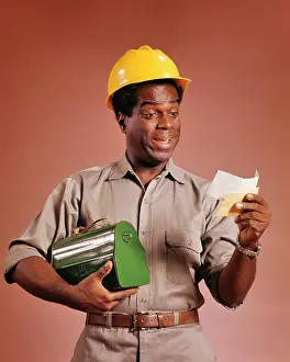 Lunchbox: African American Workman Holding Lunchbox and