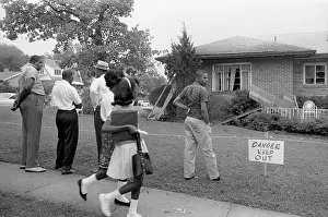 Onlooker: African Americans viewing the bomb-damaged ?