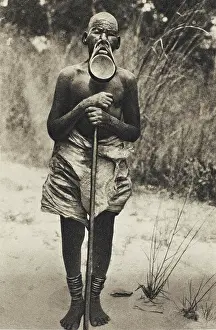 Ankles: African man with lip plate