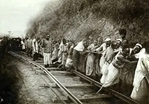 Africans: Africans pull cargo cars under German supervision, aroun