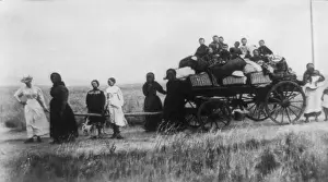18 People: Afrikaner women pulling a wagon with their children