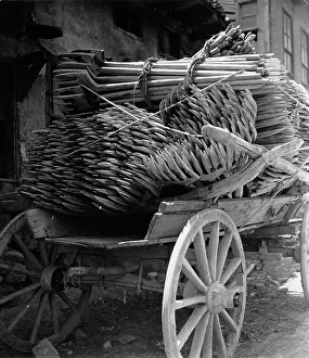 Pitchforks: Agricultural tools on a wooden cart