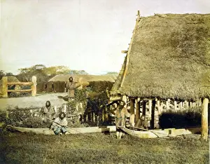 Ainu: Four Ainu men with two boats, by a thatched ?