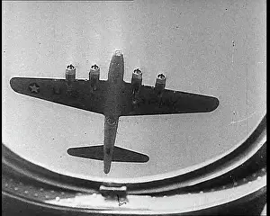 Underside: Air To Air Shot Through the Window of a Plane