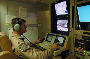 Aircraf: An Air Force officer maneuvers an unmanned ?