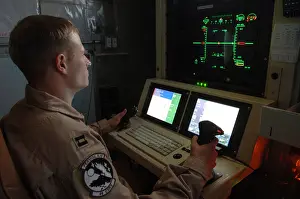 Predators: An Air Force officer maneuvers an unmanned ?