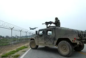 Humvee: US Airman guards the base perimeter from ?