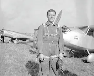 Praga: Airman posing by Praga E-115.1 aircraft