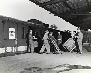 Erding: Airmen and German Men Using Wheel-Barrows Loading an Op?