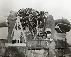 Erding: Airmen Working on a Jet Engine Mounted on a Special Fram?