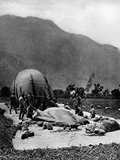 Crewmen: Airship crewmen empty a moored balloon, 1918