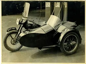 Sidecar: AJS/A J Stevens British Motorcycle & Sidecar at a Garage, En