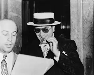 Alphons: Al Capone, with a cigar and a big smile, ?