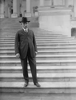 Interio: Albert B. Fall (1861-1944), posing on the ?
