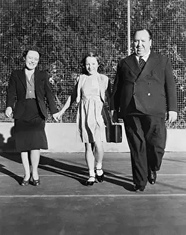 Reville: Alfred Hitchcock strolling about the grounds of