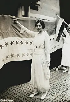 C1920: Alice Paul, full-length portrait, standing, facing left, rai