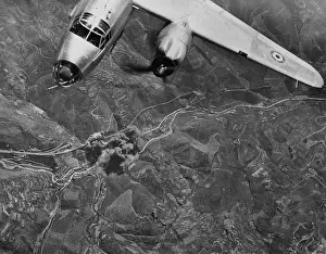 Air Force: Allied bomber hits a railroad bridge at the Piteccio