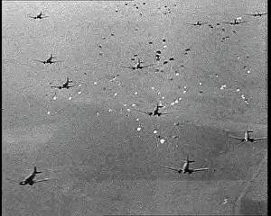 Dropping: Allied Paratroopers Dropping From Transport