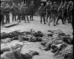 Belsen: Allied Soldiers Standing in a Ring Around A