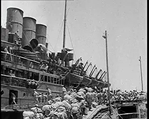 Docked: Allied Troops Marching Past a Docked Ship in
