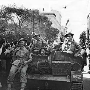 Welcomed: Allied troops being welcomed as they pass through Tunis