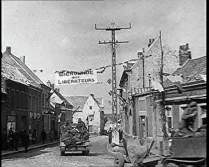 Bienvenu: Allied Vehicles Passing Through Belgian Town