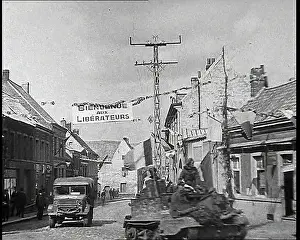 Bienvenu: Allied Vehicles Passing Through Belgian Town