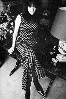 Groovy: Amanda Sturge in a checked trouser suit by Bee Young