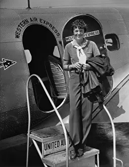 Embarks: Amelia Earhart 1897-1937 standing in the ?