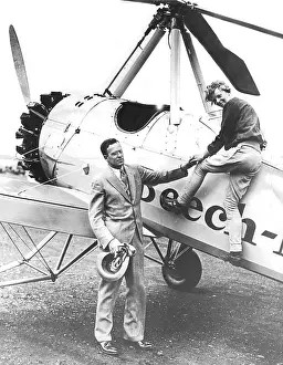 Climbs: Amelia Earhart, American pilot, with her husband