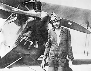 Earhart: Amelia Earhart, pioneering aviator, with plane