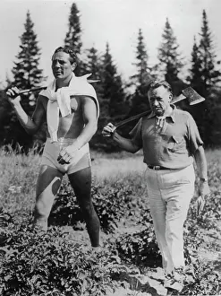 Woodcutting: The American boxer Max Baer with his