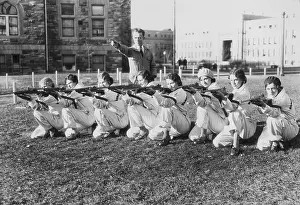 Garrard: American female students at target practice, 1931
