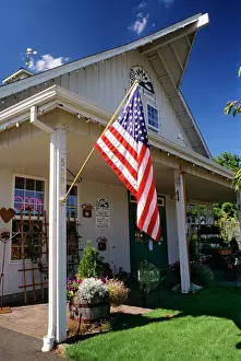 Lga001: American Flag Hanging in Front of Convenience Store